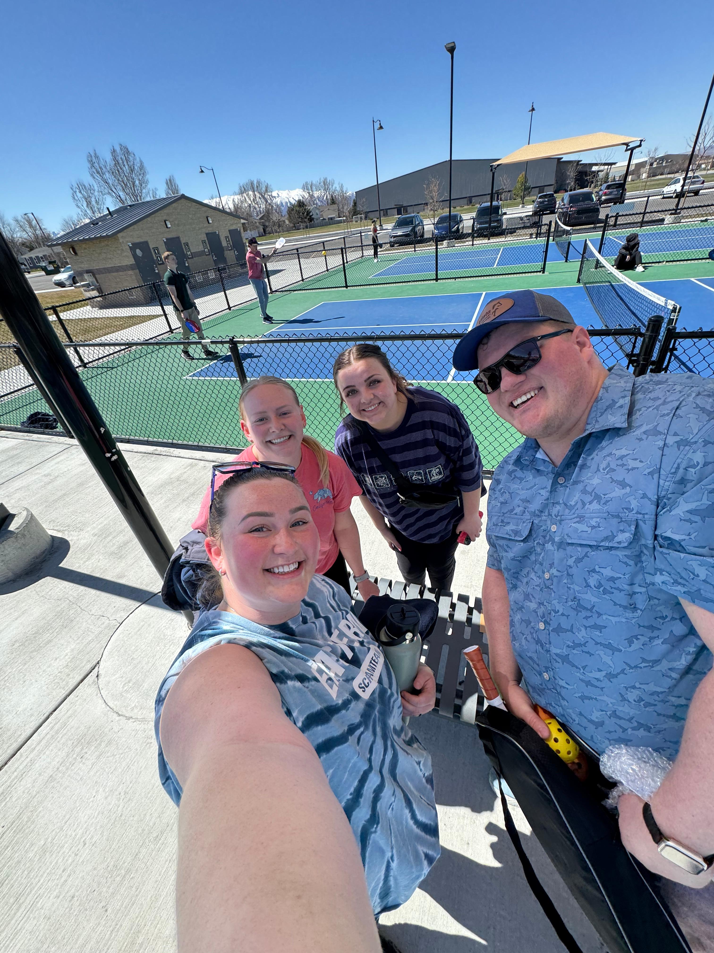 Bryson, Madi, and other friends take a study break to play pickleball.