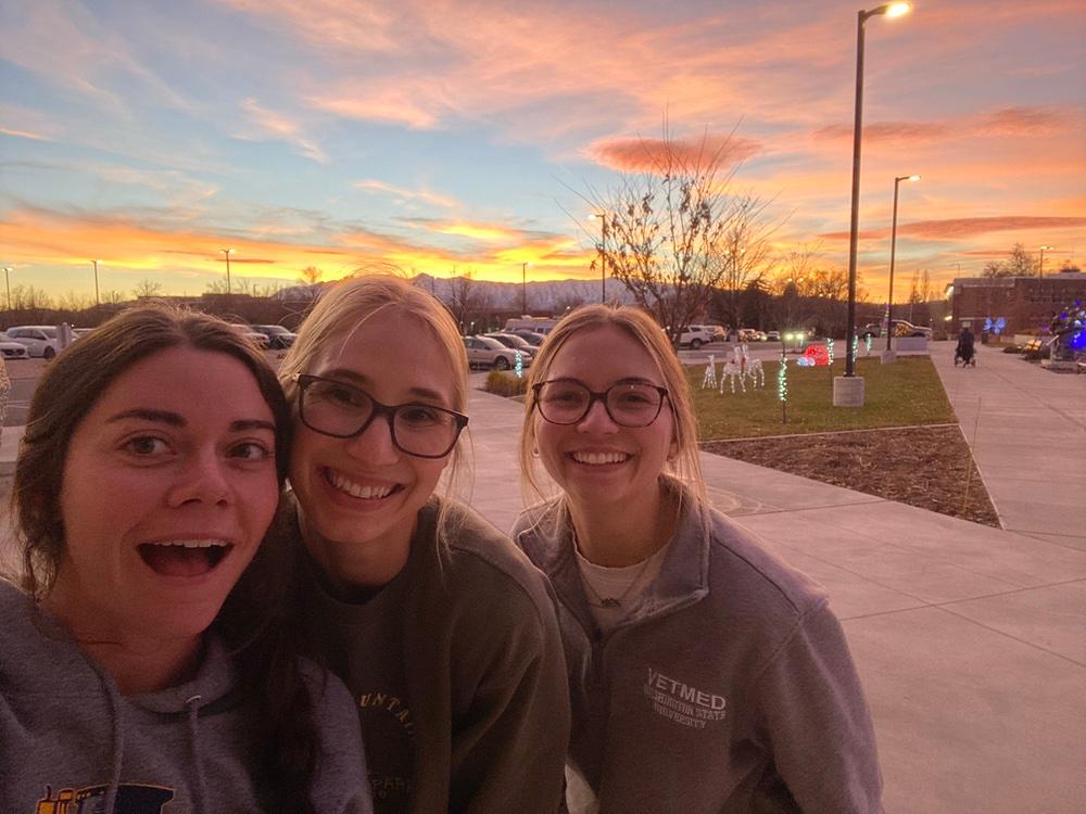 Loulou, Jorey, and Tacey enjoy one of Logan's beautiful sunsets after studying together for their last final.